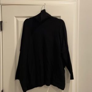 Black slouchy turtleneck sweater